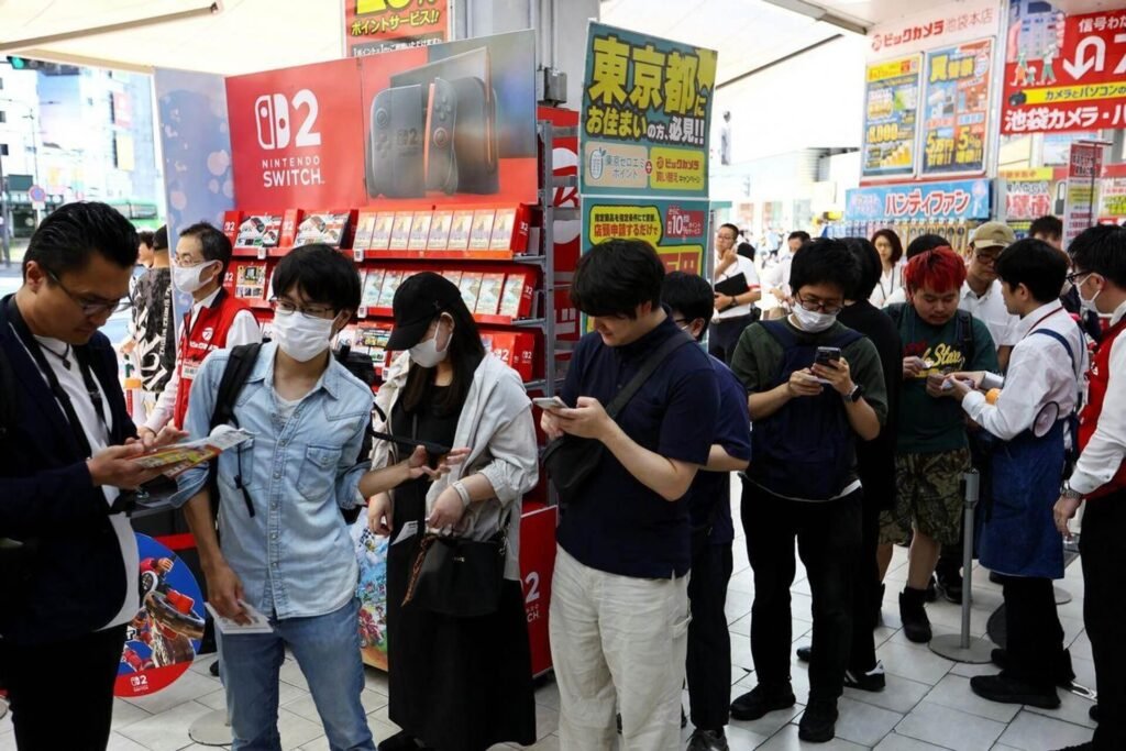 gamers lining up outside a store for nintendo switch 2 launch